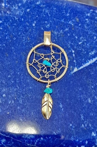 Pendentif Attrapeur de rêves en or 18 kt.